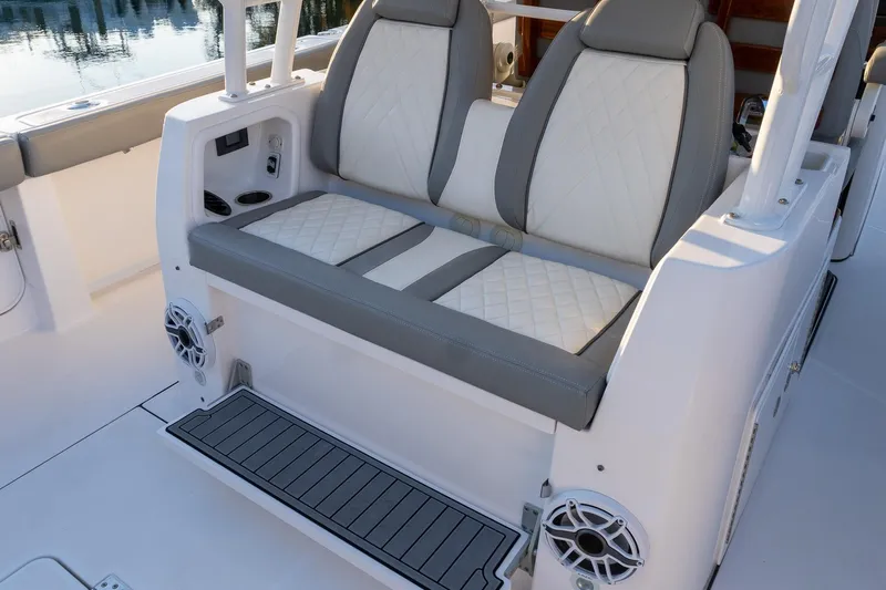 Almost Heaven Yacht Photos Pics 2024 Everglades 395 Center Console boat seating with quilted upholstery and integrated speakers.