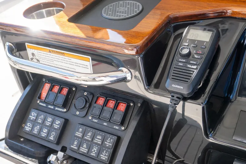 Almost Heaven Yacht Photos Pics Control panel of 2024 Everglades 395 Center Console with Garmin radio and switches.