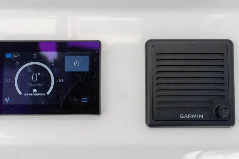 Almost Heaven Yacht Photos Pics 2024 Everglades 395 Center Console dashboard with Seakeeper and Garmin displays.