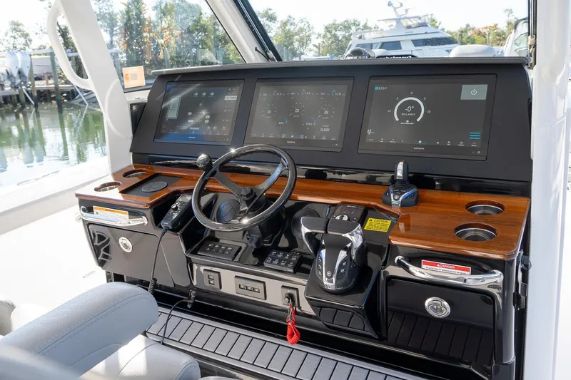Almost Heaven Yacht Photos Pics 2024 Everglades 395 Center Console helm with advanced navigation displays and controls.