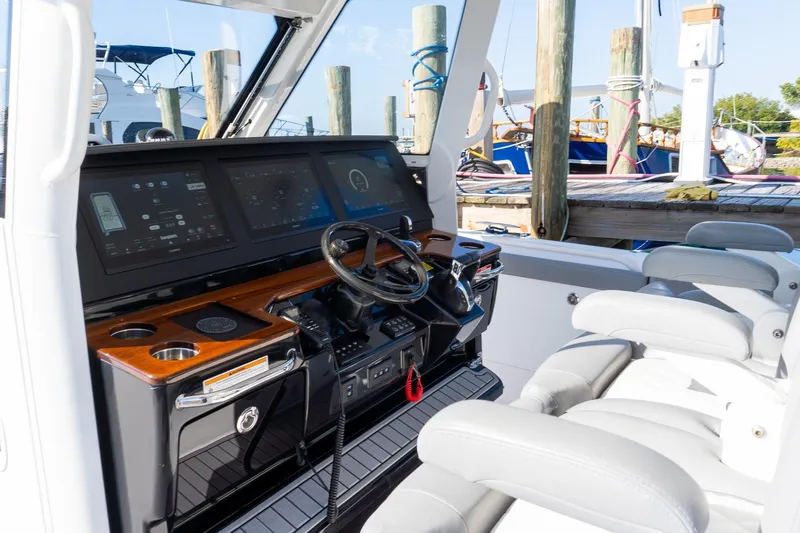 Almost Heaven Yacht Photos Pics 2024 Everglades 395 Center Console boat interior with advanced navigation system.