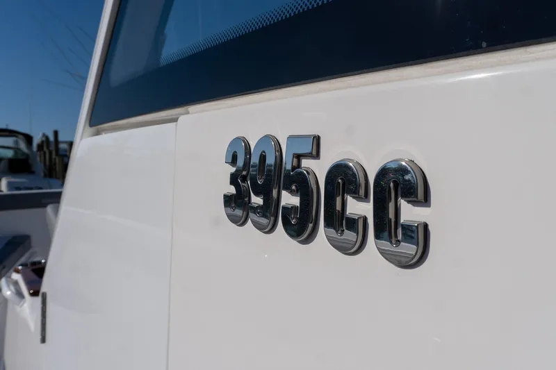 Almost Heaven Yacht Photos Pics Close-up of 2024 Everglades 395 Center Console boat emblem.