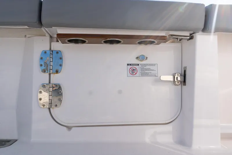 Almost Heaven Yacht Photos Pics 2024 Everglades 395 Center Console boat hatch with stainless steel hinges and warning label.