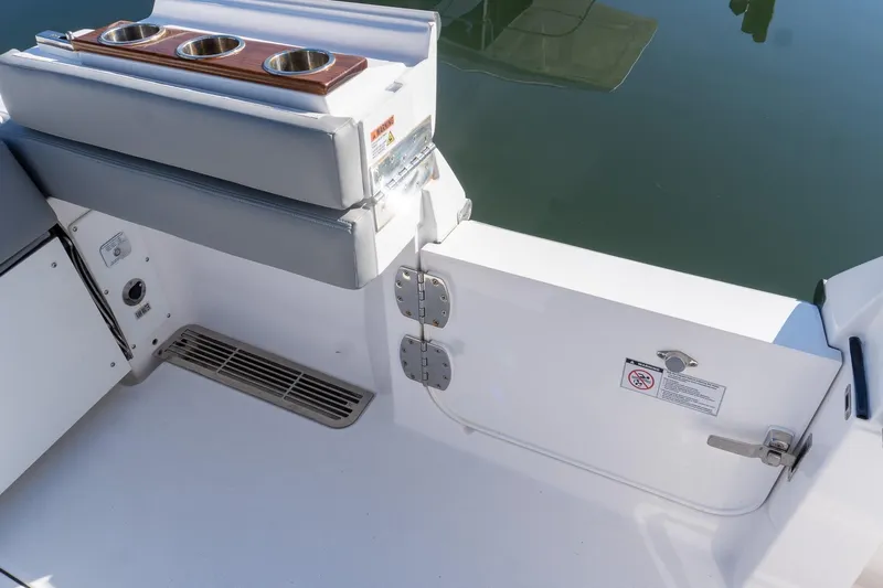 Almost Heaven Yacht Photos Pics 2024 Everglades 395 Center Console boat interior with cup holders and seating.