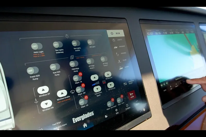 Almost Heaven Yacht Photos Pics Touchscreen controls on 2024 Everglades 395 Center Console boat dashboard.