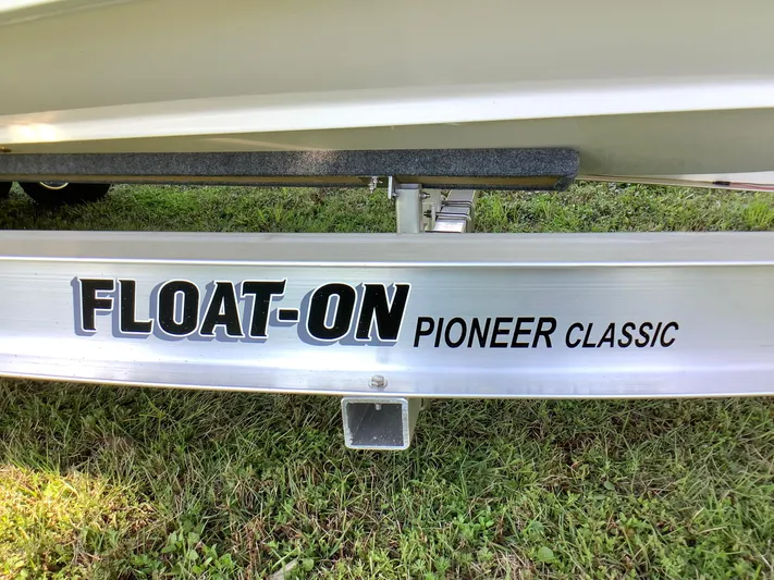 Highly Upgraded - 2025 Century 2600 Cc Yacht Photos Pics Trailer with "FLOAT-ON PIONEER CLASSIC" text, supporting a 2025 Century 2600 Center Console boat.