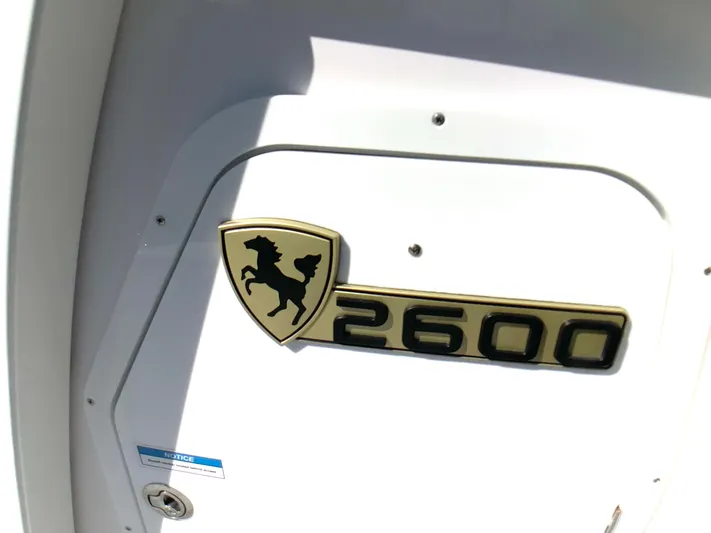 Highly Upgraded - 2025 Century 2600 Cc Yacht Photos Pics Century 2600 Center Console 2025 emblem on white surface, featuring a horse logo.