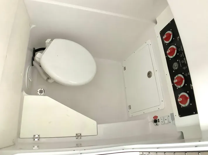 Highly Upgraded - 2025 Century 2600 Cc Yacht Photos Pics 2025 Century 2600 Center Console boat interior with toilet and control panel.