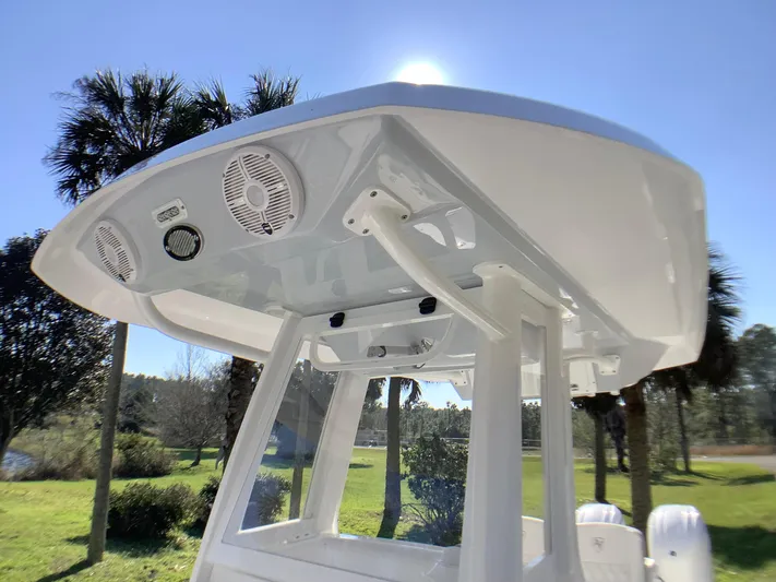 Highly Upgraded - 2025 Century 2600 Cc Yacht Photos Pics 2025 Century 2600 Center Console boat with T-top and speakers, set against a sunny backdrop.