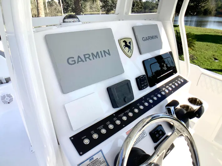 Highly Upgraded - 2025 Century 2600 Cc Yacht Photos Pics 2025 Century 2600 Center Console boat dashboard with Garmin navigation systems.