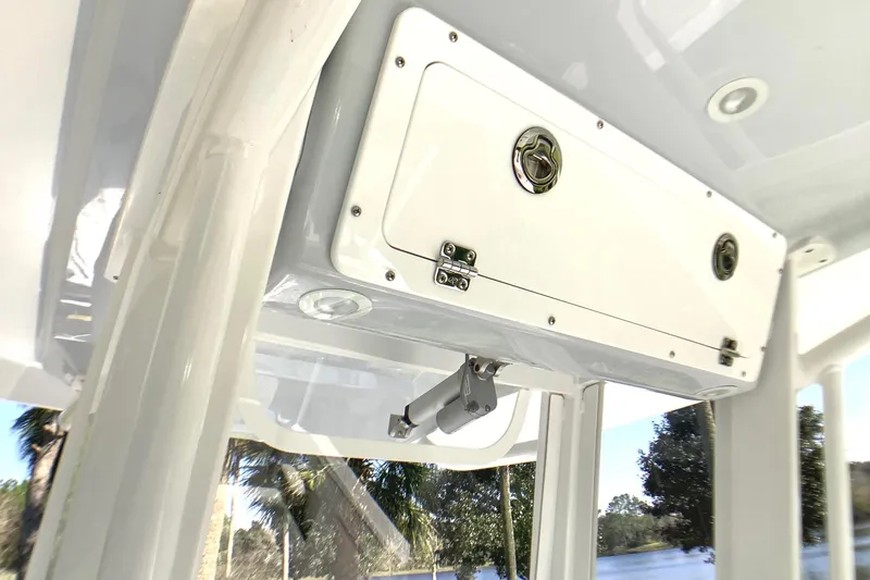 Highly Upgraded - 2025 Century 2600 Cc Yacht Photos Pics 2025 Century 2600 Center Console storage compartment, white finish, outdoor setting.