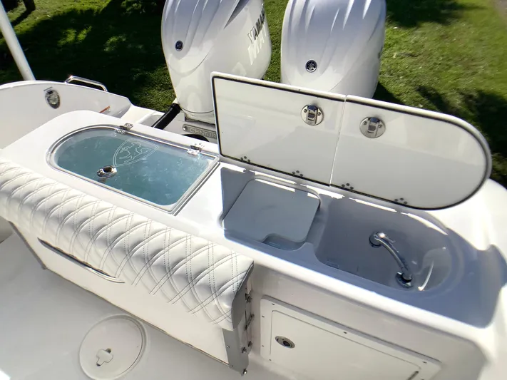 Highly Upgraded - 2025 Century 2600 Cc Yacht Photos Pics 2025 Century 2600 Center Console boat with dual engines and open storage compartments.