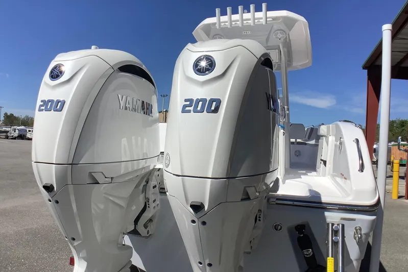 Highly Upgraded - 2025 Century 2600 Cc Yacht Photos Pics 2025 Century 2600 Center Console with twin Yamaha 200 engines, docked outdoors.