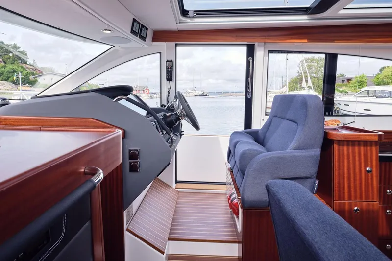  Yacht Photos Pics Interior of 2026 Nimbus 405 Coup&eacute; yacht with luxurious seating and wooden finishes.