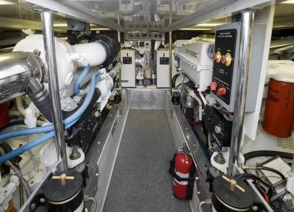 Motivator Yacht Photos Pics Engine room of a 1982 Pacifica Convertible boat, featuring complex machinery and control systems.