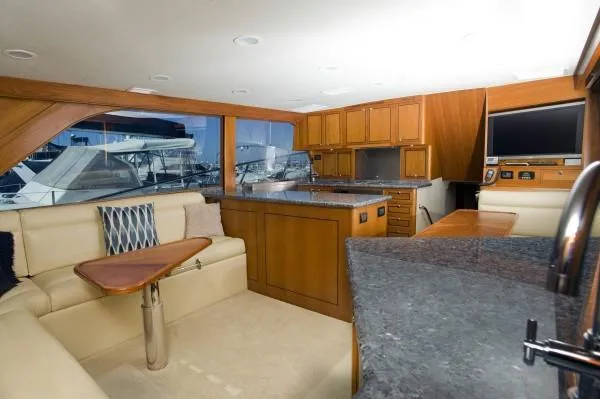Motivator Yacht Photos Pics Luxurious 1982 Pacifica Convertible yacht interior with modern kitchen and seating area.