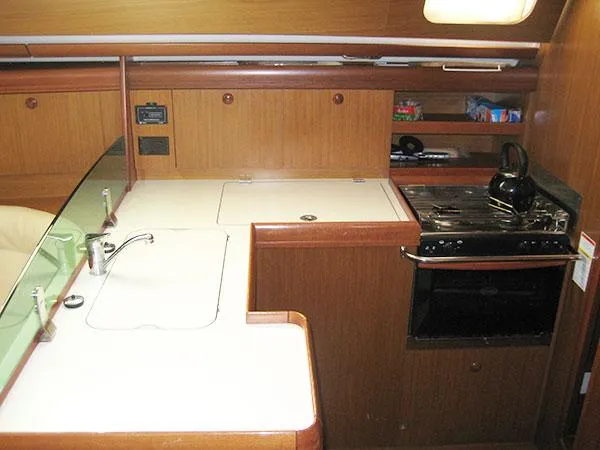 R Yacht Photos Pics Interior of 2006 Jeanneau Sun Odyssey 42 DS yacht kitchen with stove and sink.