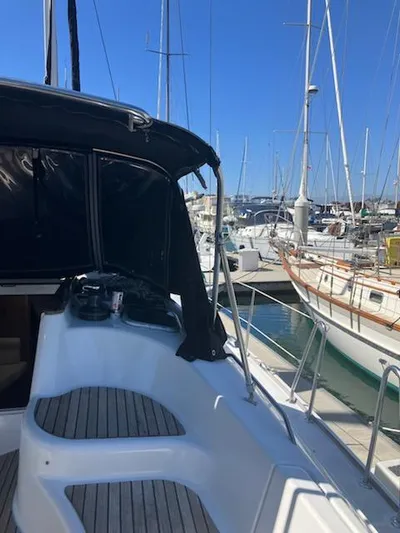 R Yacht Photos Pics 2006 Jeanneau Sun Odyssey 42 DS sailboat docked in a marina, featuring sleek design.