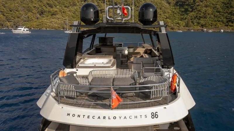  Yacht Photos Pics Luxury Monte Carlo Yachts MCY 86, 2016 model, cruising on serene waters.