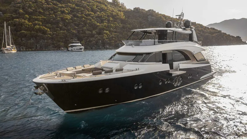  Yacht Photos Pics Luxurious 2016 Monte Carlo Yachts MCY 86 cruising in scenic waters.