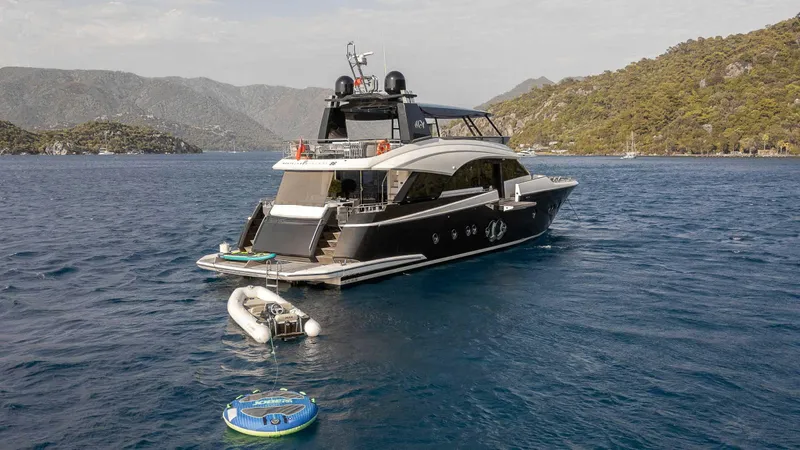  Yacht Photos Pics Luxury Monte Carlo Yachts MCY 86, 2016 model, anchored in scenic waters.