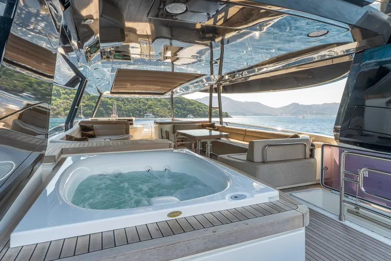  Yacht Photos Pics Luxurious 2016 Monte Carlo Yachts MCY 86 with jacuzzi and scenic ocean view.