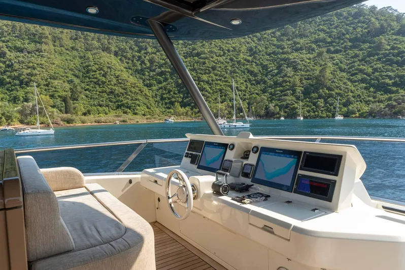  Yacht Photos Pics Helm of 2016 Monte Carlo Yachts MCY 86 with scenic ocean view.