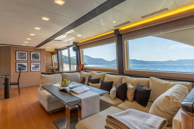  Yacht Photos Pics Luxurious interior of 2016 Monte Carlo Yachts MCY 86 with ocean view and elegant seating.