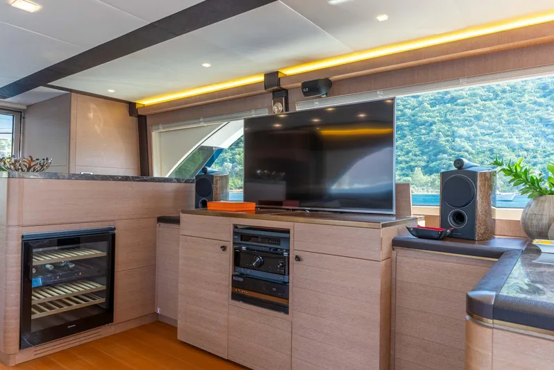  Yacht Photos Pics Luxurious interior of 2016 Monte Carlo Yachts MCY 86 with modern entertainment system.