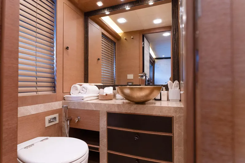  Yacht Photos Pics Luxurious bathroom in 2016 Monte Carlo Yachts MCY 86 with elegant fixtures and decor.