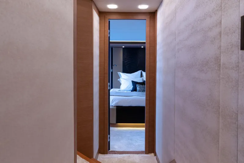  Yacht Photos Pics Luxurious interior hallway leading to a bedroom on a 2016 Monte Carlo Yachts MCY 86.