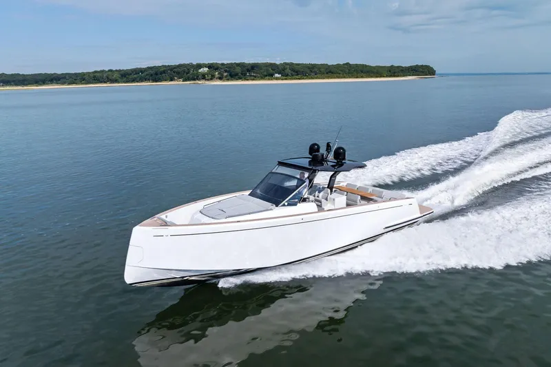 Lady Di Yacht Photos Pics 2024 Pardo Yachts 43 cruising on calm waters near a scenic coastline.