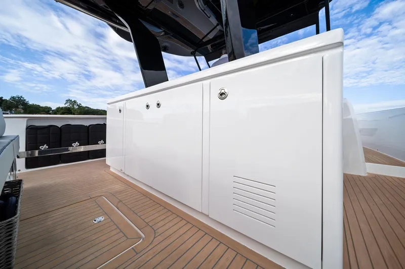 Lady Di Yacht Photos Pics 2024 Pardo Yachts 43 deck with sleek cabinetry and teak flooring under a blue sky.