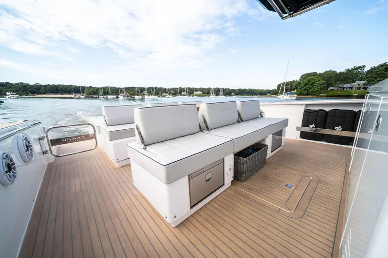 Lady Di Yacht Photos Pics Luxurious 2024 Pardo Yachts 43 deck with seating, overlooking serene marina.