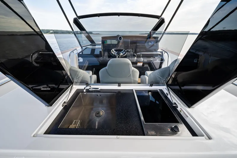 Lady Di Yacht Photos Pics 2024 Pardo Yachts 43 cockpit with sink and stove, featuring sleek design and modern amenities.