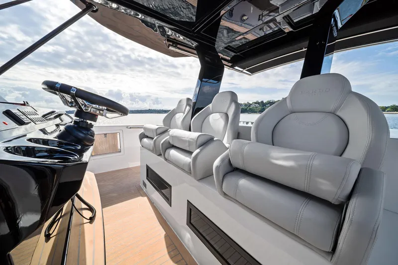 Lady Di Yacht Photos Pics Luxurious interior of 2024 Pardo Yachts 43 with sleek helm and plush seating.
