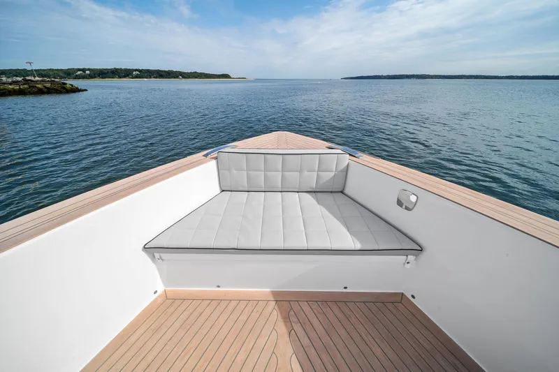 Lady Di Yacht Photos Pics 2024 Pardo Yachts 43 bow with cushioned seating, overlooking serene ocean view.