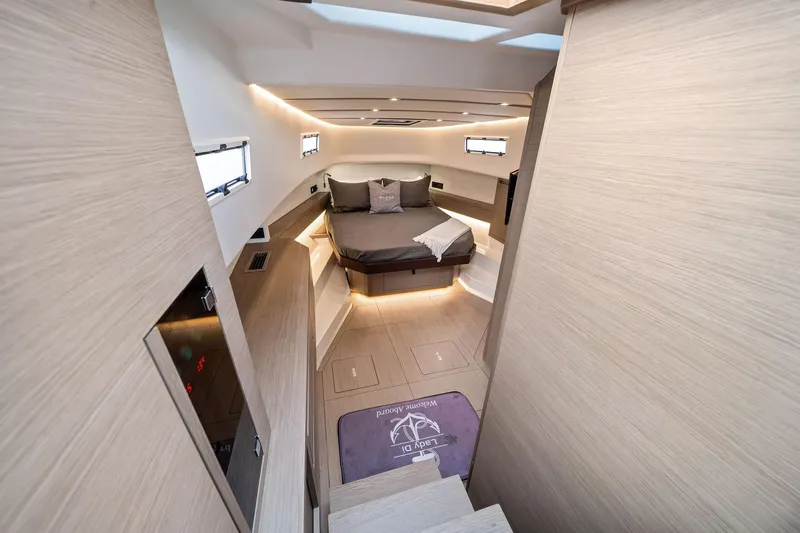Lady Di Yacht Photos Pics Luxurious interior of 2024 Pardo Yachts 43, featuring a cozy bed and modern design.