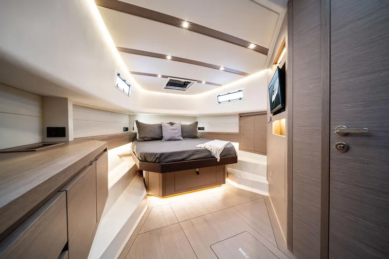 Lady Di Yacht Photos Pics Luxurious interior of 2024 Pardo Yachts 43, featuring a modern bedroom with elegant wood finishes.