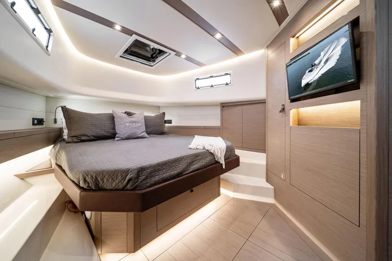 Lady Di Yacht Photos Pics Luxurious interior of 2024 Pardo Yachts 43 with modern bedroom and TV.