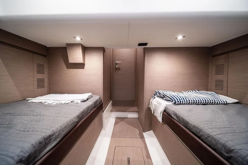Lady Di Yacht Photos Pics Luxurious cabin interior of 2024 Pardo Yachts 43 with twin beds and modern design.