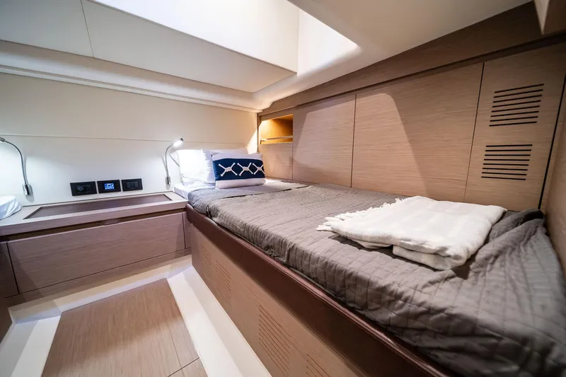Lady Di Yacht Photos Pics Luxurious cabin interior of 2024 Pardo Yachts 43, featuring modern design and cozy bedding.
