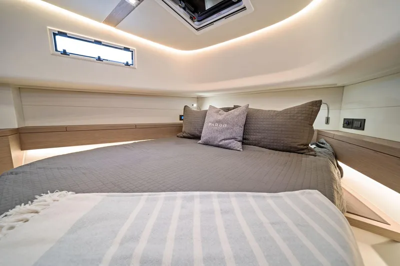 Lady Di Yacht Photos Pics Luxurious cabin interior of 2024 Pardo Yachts 43, featuring elegant bedding and modern lighting.
