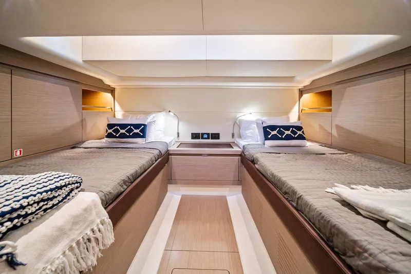 Lady Di Yacht Photos Pics Luxurious cabin interior of 2024 Pardo Yachts 43 with twin beds and elegant decor.