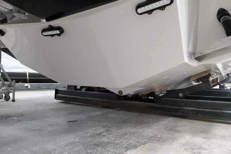  Yacht Photos Pics 2026 Formula 310 Bowrider OB boat hull on trailer, close-up view.