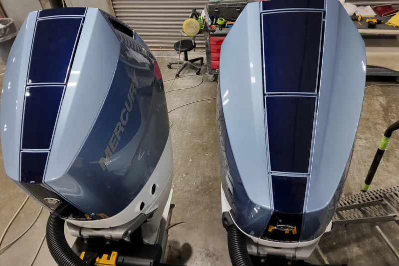  Yacht Photos Pics Twin Mercury outboard engines on a 2026 Formula 310 Bowrider OB in a workshop setting.