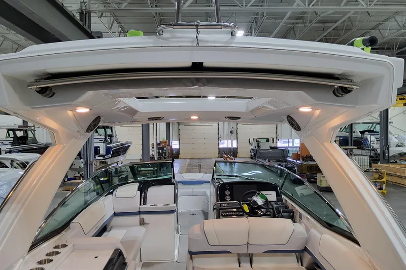  Yacht Photos Pics 2026 Formula 310 Bowrider OB interior with seating and dashboard in a showroom.