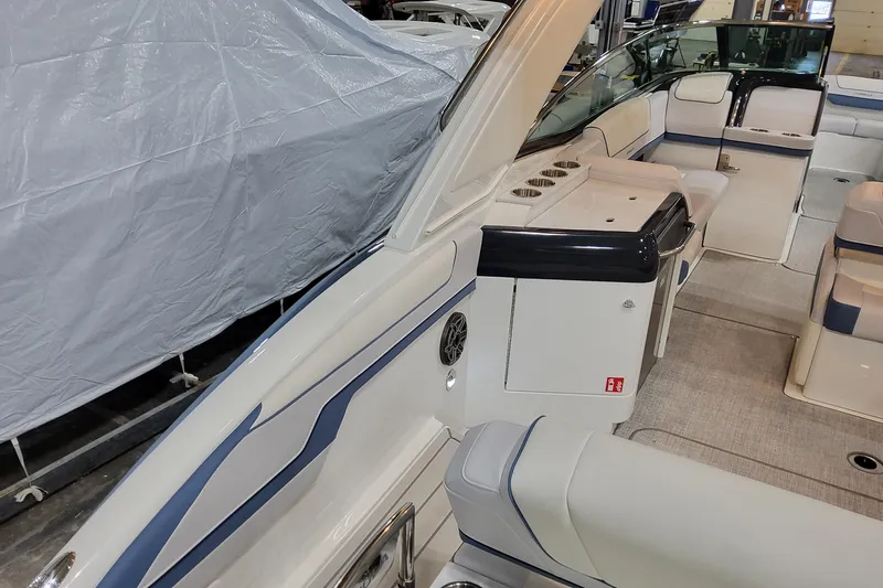  Yacht Photos Pics 2026 Formula 310 Bowrider OB interior with seating and storage, showcasing luxury design.