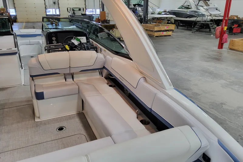  Yacht Photos Pics 2026 Formula 310 Bowrider OB interior with luxurious seating in a showroom.
