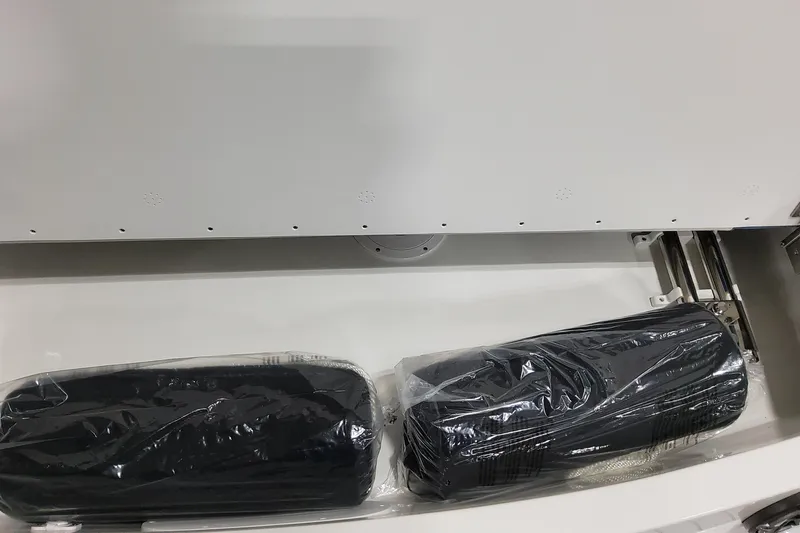  Yacht Photos Pics Storage compartment in 2026 Formula 310 Bowrider OB with packaged items inside.